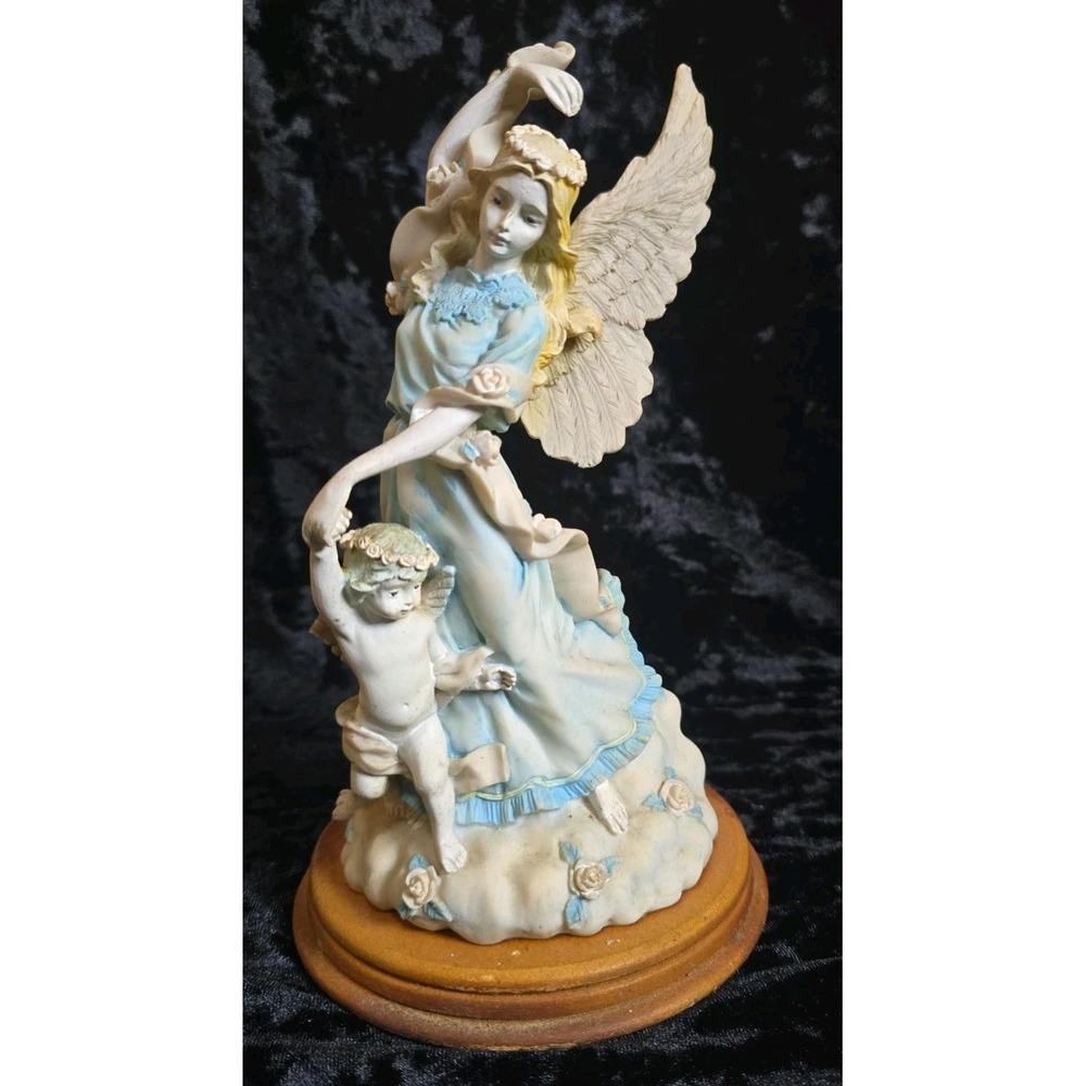 Cloud Dancing Angel and Cherub Figurine on a round wooden base